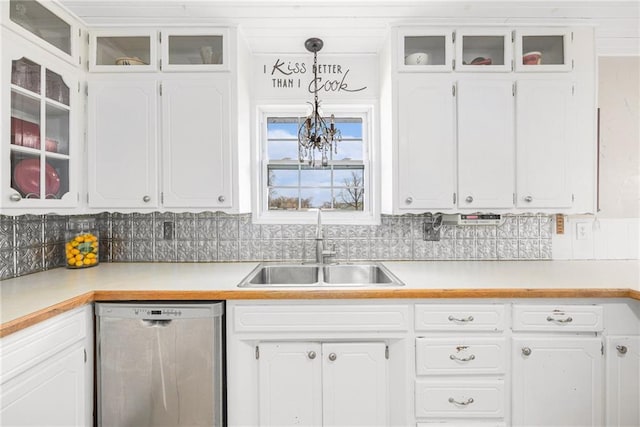 kitchen featuring white cabinets, a sink, and stainless steel dishwasher