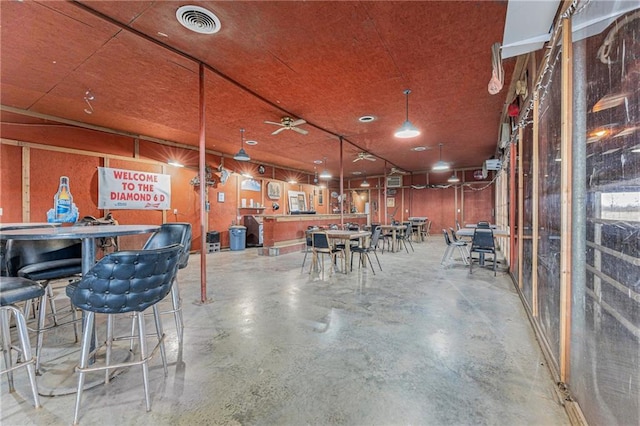 miscellaneous room with visible vents and finished concrete floors