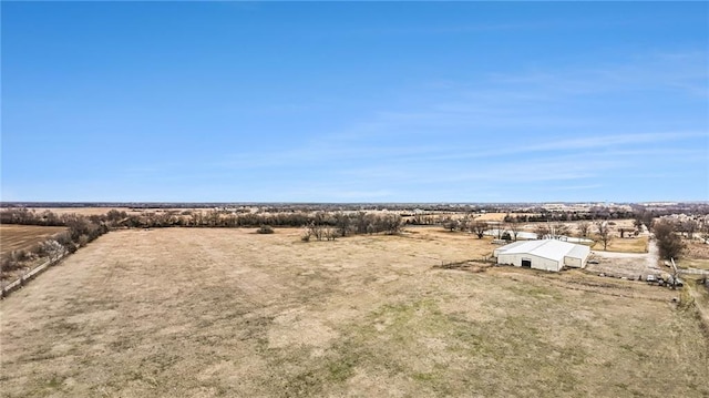 birds eye view of property with a rural view