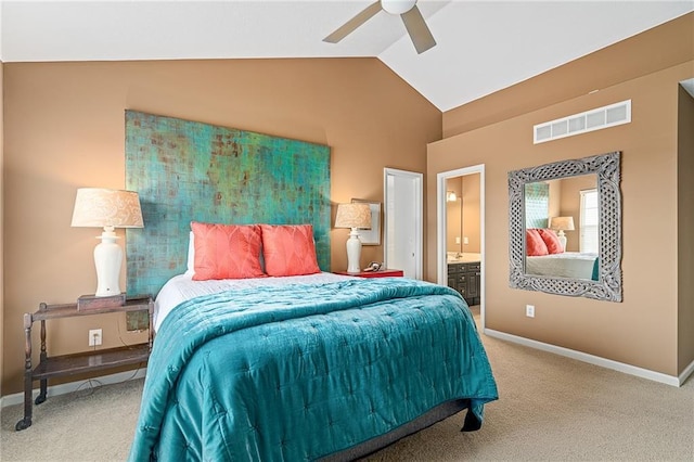 carpeted bedroom featuring ceiling fan, ensuite bathroom, visible vents, baseboards, and vaulted ceiling