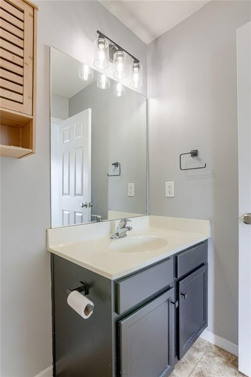 bathroom featuring vanity and baseboards