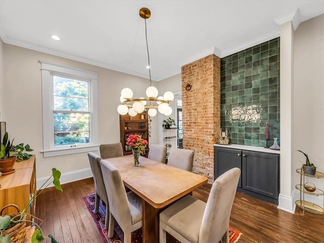 dining space with baseboards, dark wood finished floors, crown molding, and recessed lighting