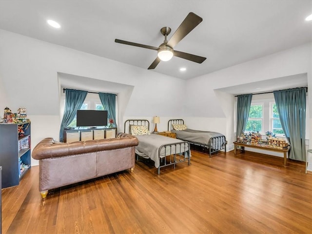 bedroom featuring recessed lighting and wood finished floors