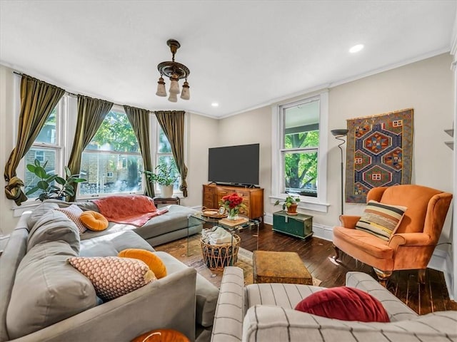 living area with hardwood / wood-style flooring, baseboards, crown molding, and recessed lighting