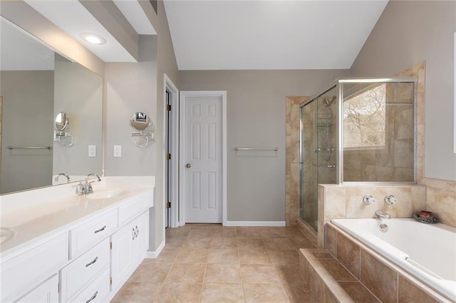full bathroom featuring a garden tub, double vanity, a sink, and a stall shower
