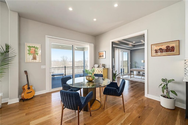 dining space with recessed lighting, baseboards, and light wood-style floors