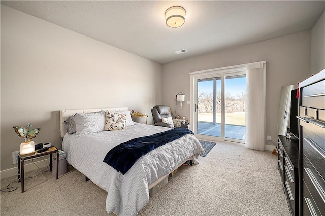 bedroom featuring access to exterior, light colored carpet, baseboards, and visible vents