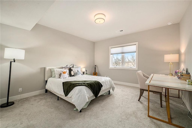 carpeted bedroom with visible vents and baseboards