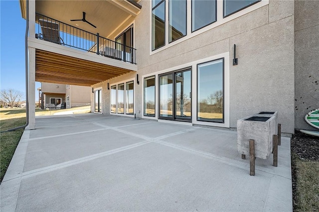 view of patio / terrace featuring ceiling fan