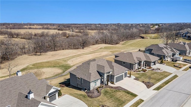 birds eye view of property with view of golf course