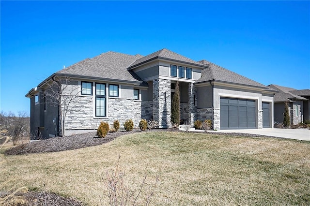 prairie-style home featuring stucco siding, a front lawn, stone siding, concrete driveway, and an attached garage