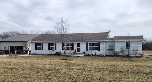 ranch-style home with an attached garage and a front lawn