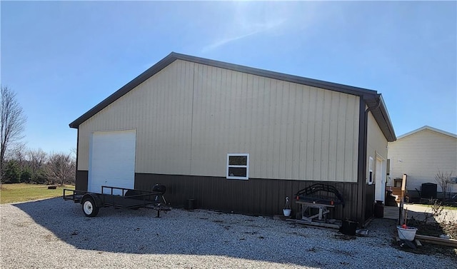 view of home's exterior featuring an outbuilding, driveway, and a garage