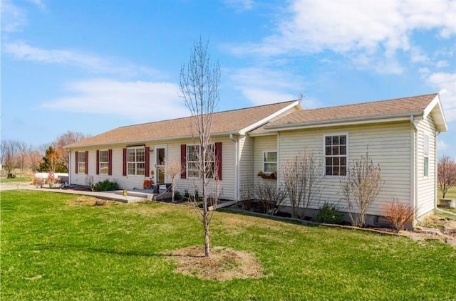 rear view of property with a yard