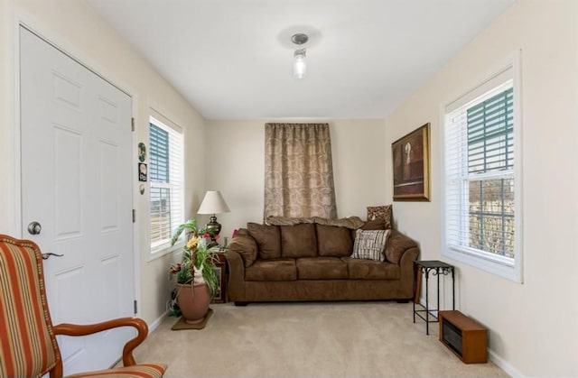 living room featuring baseboards and carpet flooring