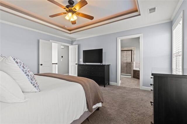 carpeted bedroom with ornamental molding, a raised ceiling, visible vents, and baseboards