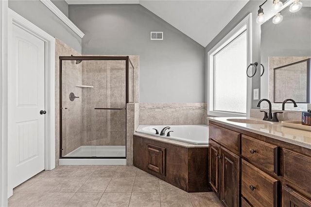 bathroom with visible vents, tile patterned floors, a garden tub, vaulted ceiling, and a shower stall