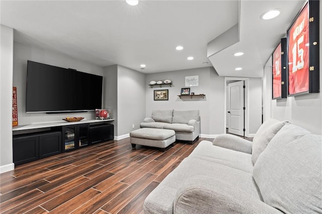 living room featuring dark wood-style floors, recessed lighting, and baseboards