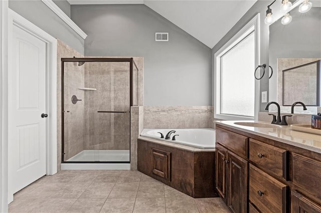 full bath featuring a garden tub, visible vents, a shower stall, tile patterned floors, and lofted ceiling