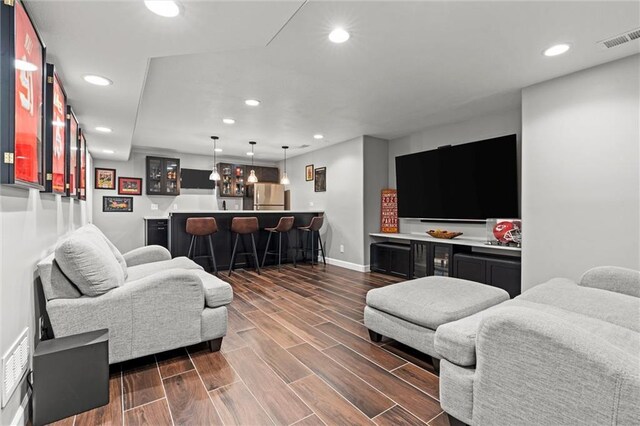 630 N Laurel St, Gardner, KS 66030 - living area with indoor wet bar, recessed lighting, visible vents, and dark wood-style floors