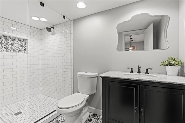 full bathroom with vanity, tile patterned floors, a shower stall, and toilet