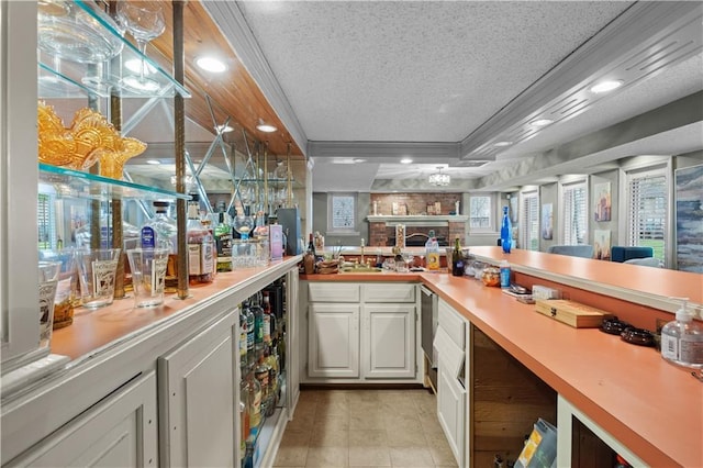 132 The Woodlands Dr, Gladstone, MO 64119 - bar with a textured ceiling, a sink, indoor wet bar, a raised ceiling, and recessed lighting