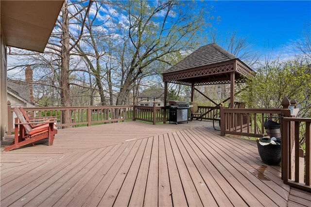 132 The Woodlands Dr, Gladstone, MO 64119 - deck with a gazebo and area for grilling