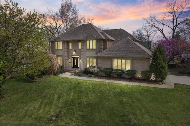 132 The Woodlands Dr, Gladstone, MO 64119 - french country home with a lawn and a shingled roof
