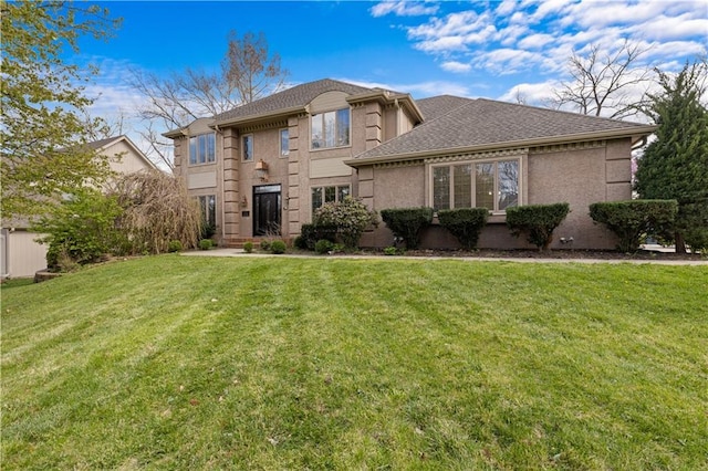132 The Woodlands Dr, Gladstone, MO 64119 - traditional-style house with a shingled roof and a front yard
