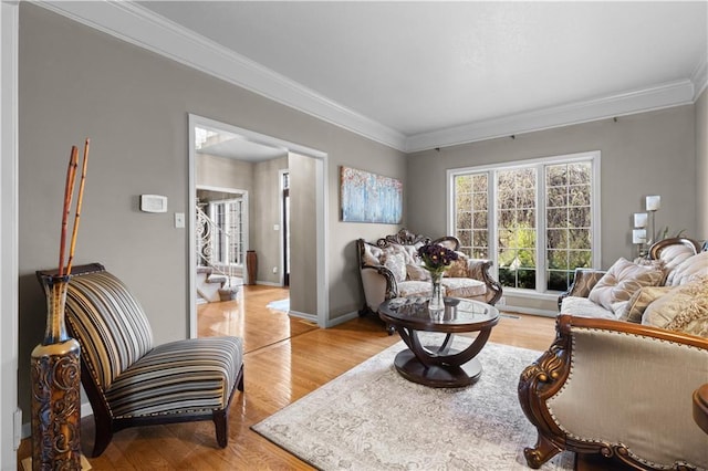 132 The Woodlands Dr, Gladstone, MO 64119 - living room with baseboards, crown molding, and light wood-type flooring