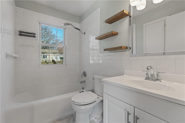 full bathroom with toilet, marble finish floor, shower / tub combination, tile walls, and vanity