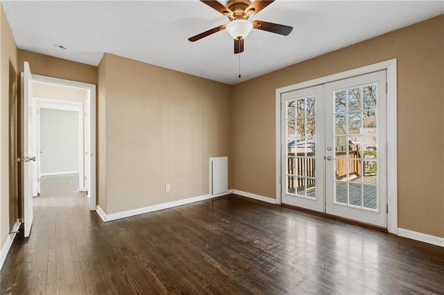 unfurnished room with ceiling fan, french doors, dark wood-type flooring, and baseboards