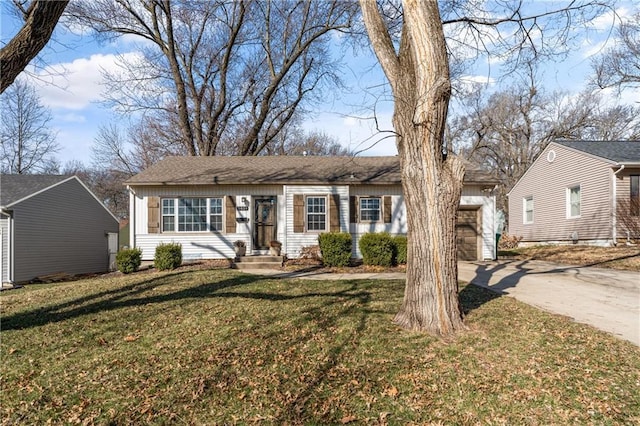 ranch-style house with a front lawn and driveway