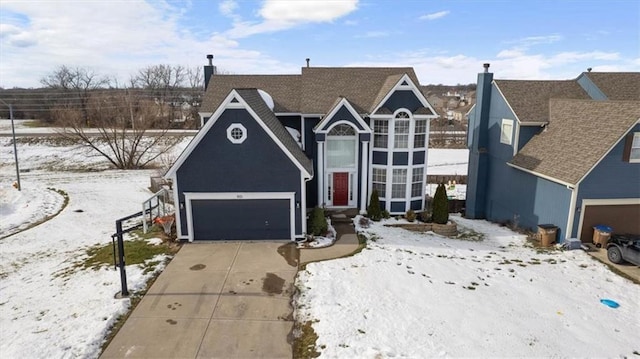 traditional-style home featuring driveway and a garage