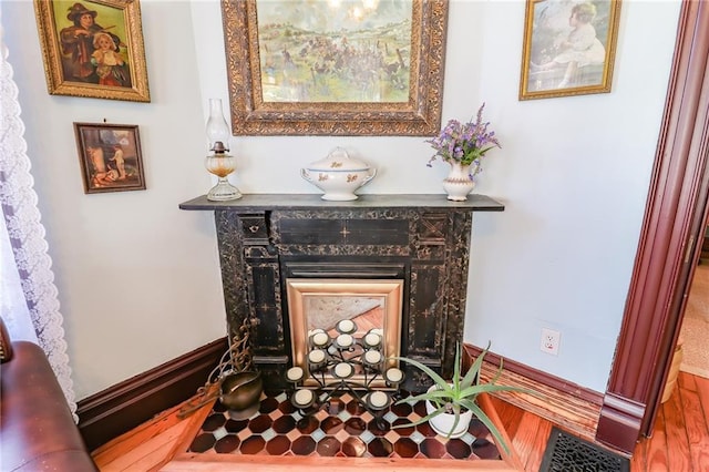 room details with a fireplace and baseboards