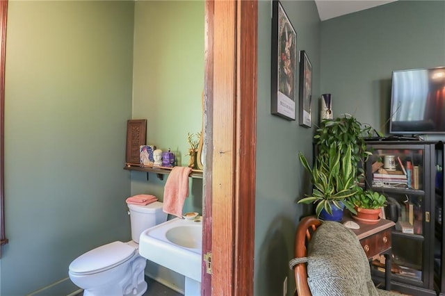 half bathroom with a sink and toilet