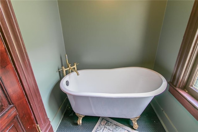 full bath featuring a freestanding tub