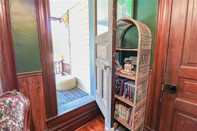 room details featuring wainscoting and wood finished floors