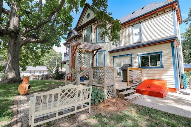 exterior space with fence and a wooden deck