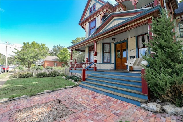 view of front of house featuring french doors and a porch