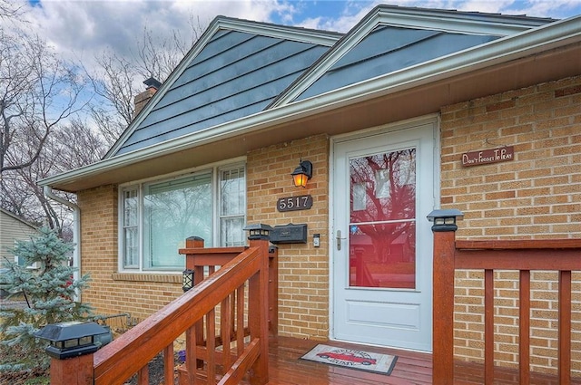 property entrance with brick siding