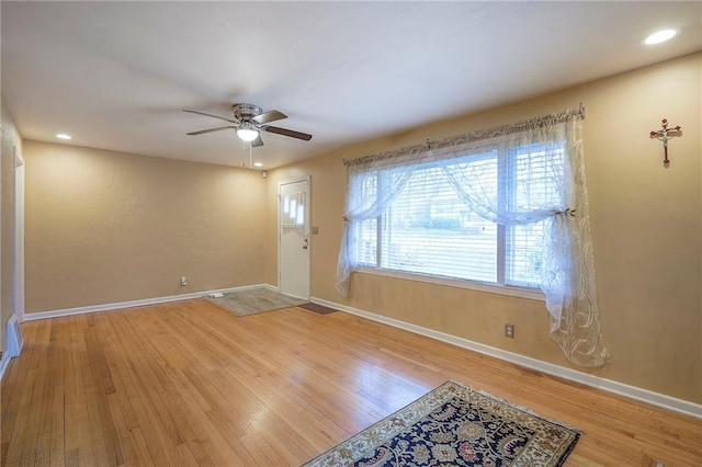 entrance foyer with recessed lighting, wood-type flooring, and baseboards