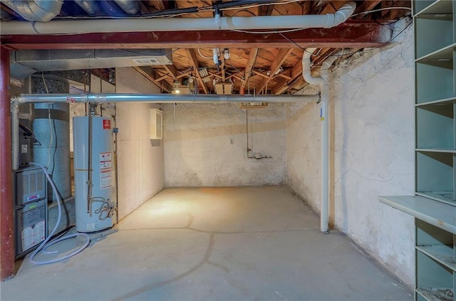 unfinished basement featuring gas water heater