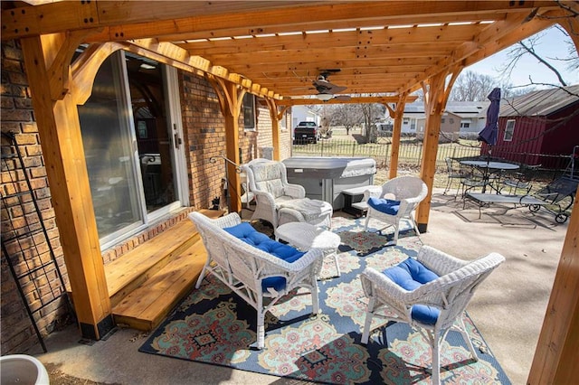 view of patio / terrace with outdoor dining area, ceiling fan, and fence