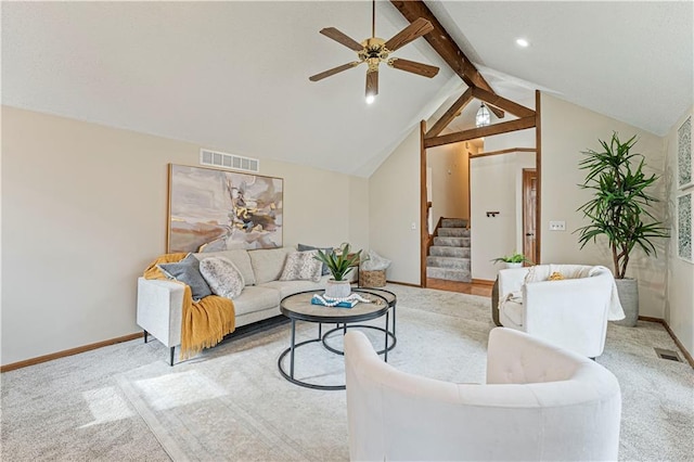 living area with carpet flooring, visible vents, stairway, and lofted ceiling with beams