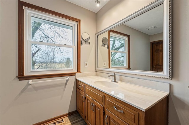 bathroom featuring visible vents and vanity