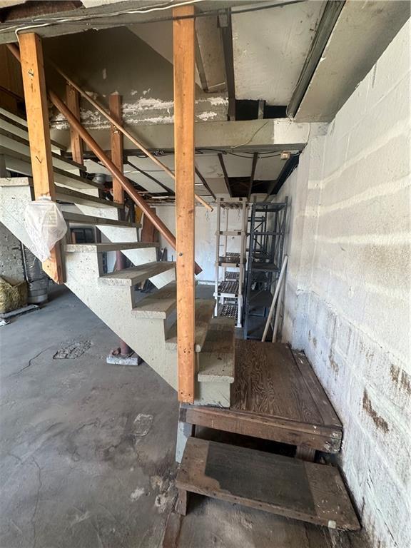 unfinished basement with stairway