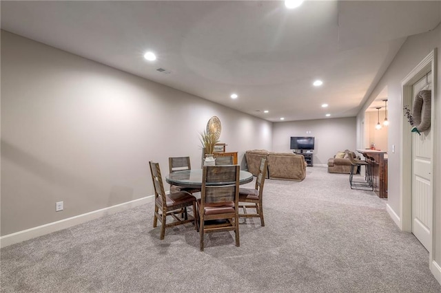 dining area with baseboards, carpet, visible vents, and recessed lighting