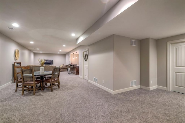 carpeted dining area featuring recessed lighting and visible vents