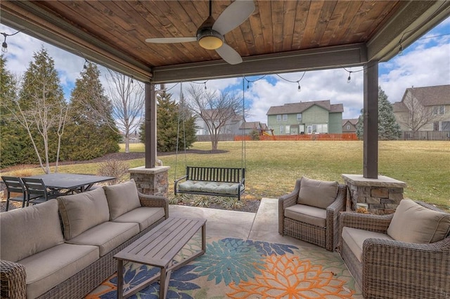 view of patio featuring an outdoor hangout area, a ceiling fan, and outdoor dining space